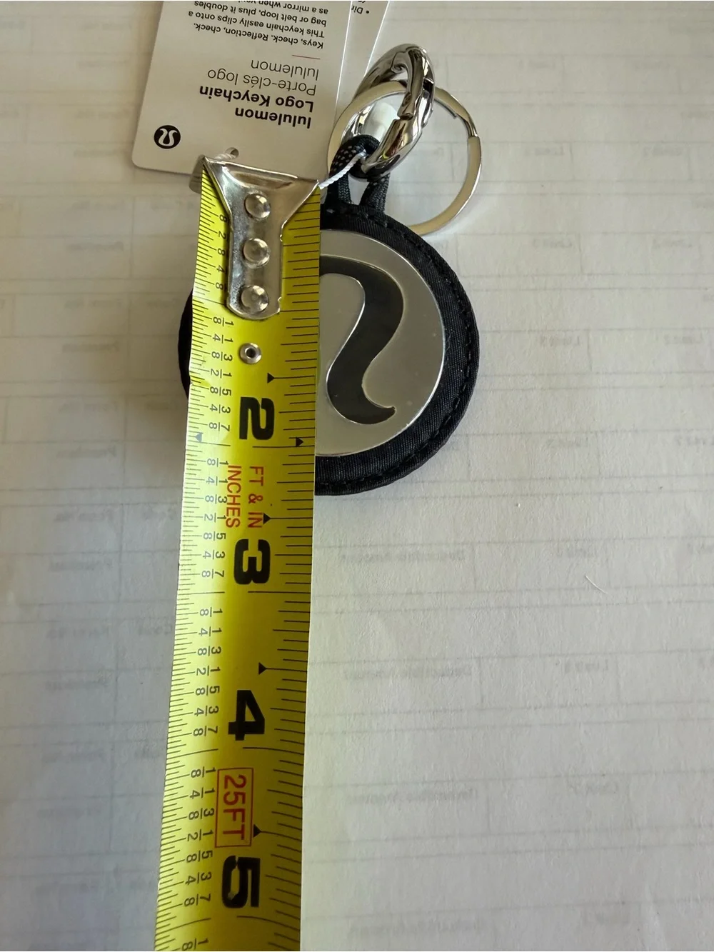 Lululemon Round Logo Keychain in Black and Silver